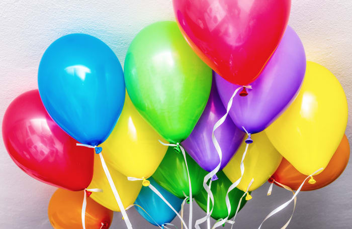 A balloon is filled with helium gas
