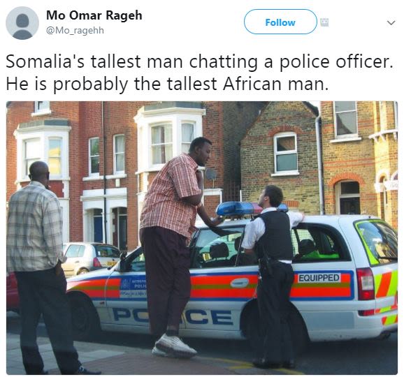 Mo omar rageh mo_ragehh follow somalia's tallest man chatting a police officer.