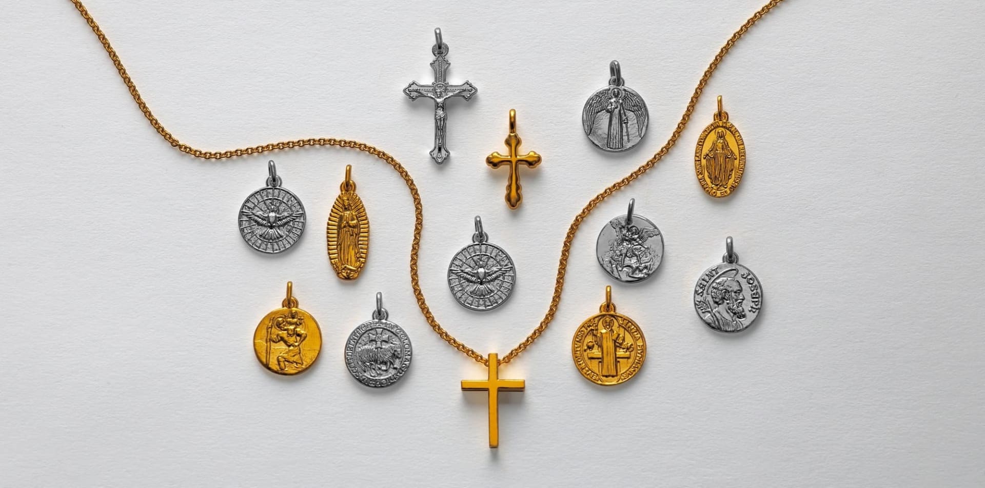24k gold and pure platinum cross pendants and religious medallions.