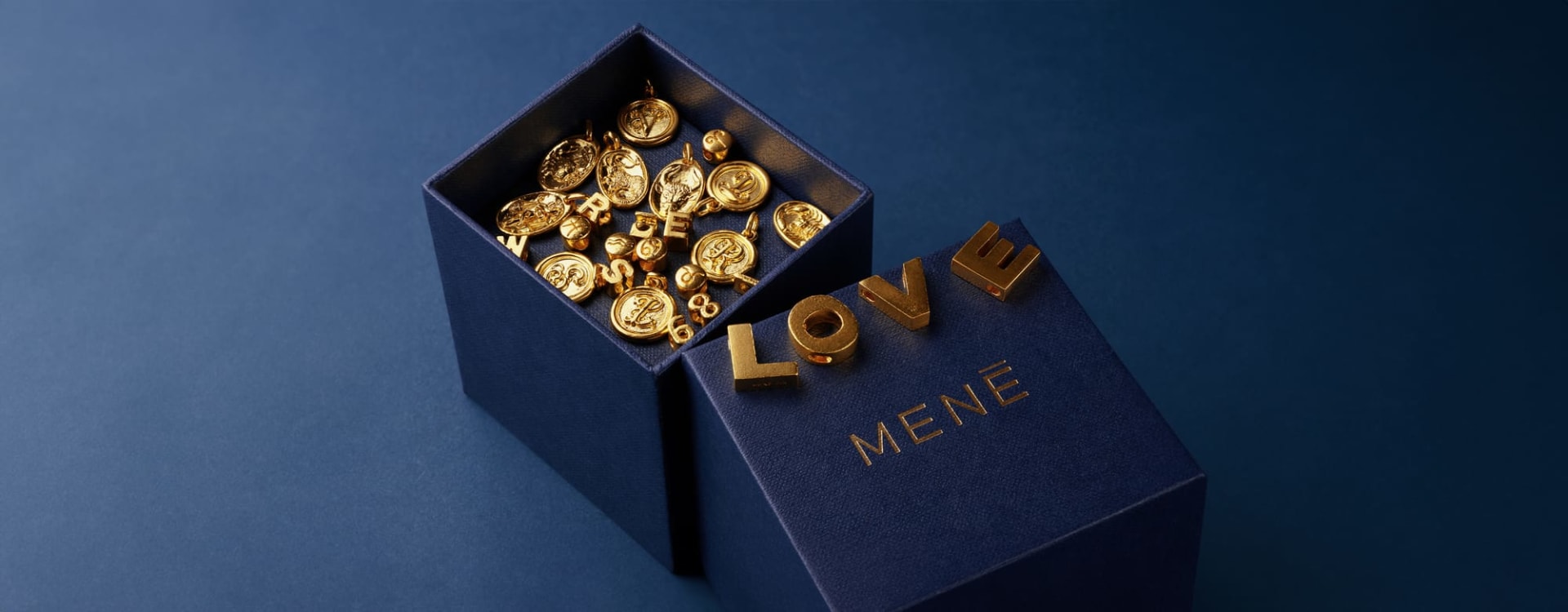 Menē 24k gold charms and pendants.