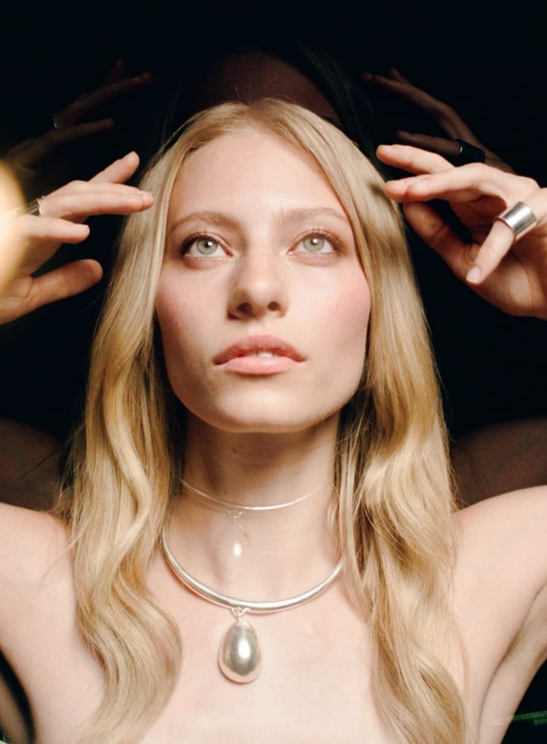 Menē pure silver pieces worn on the body, illustrating pure silver as an everyday precious metal.