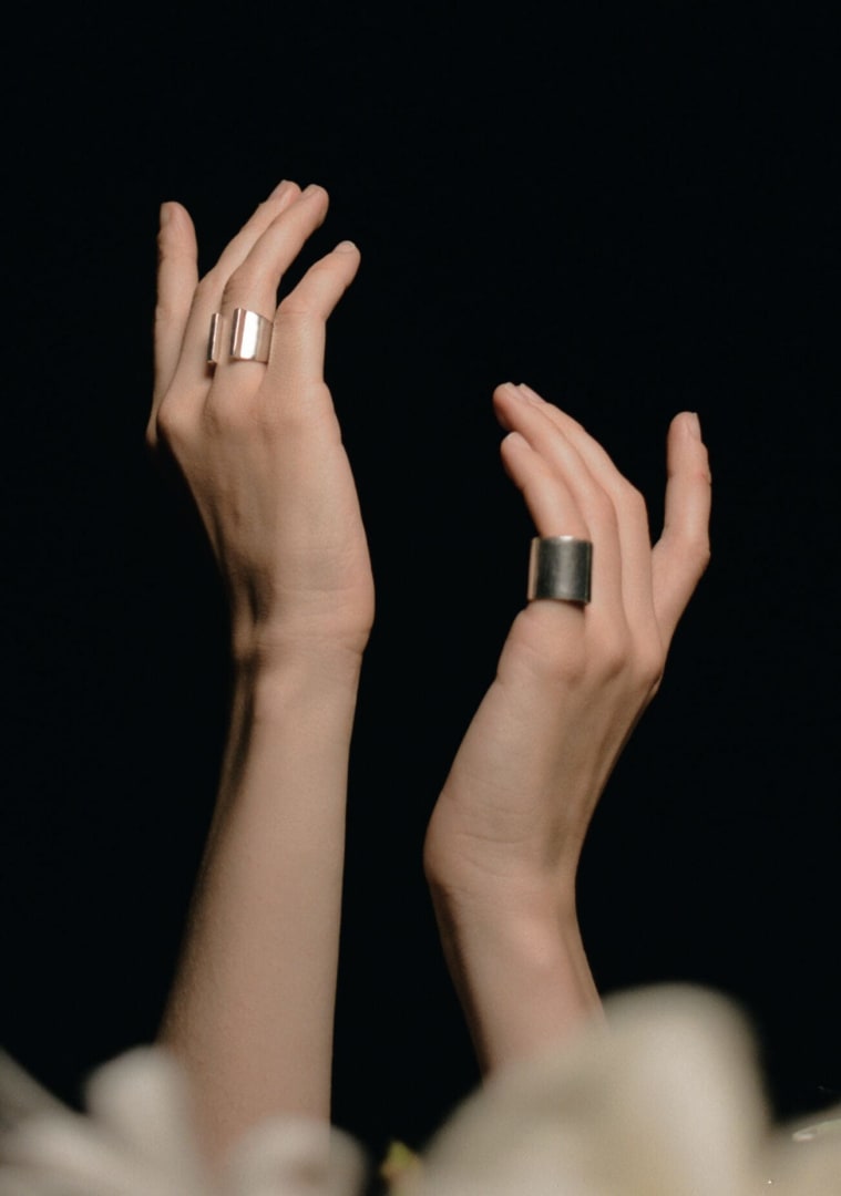 Woman wearing Menē pure silver jewelry.