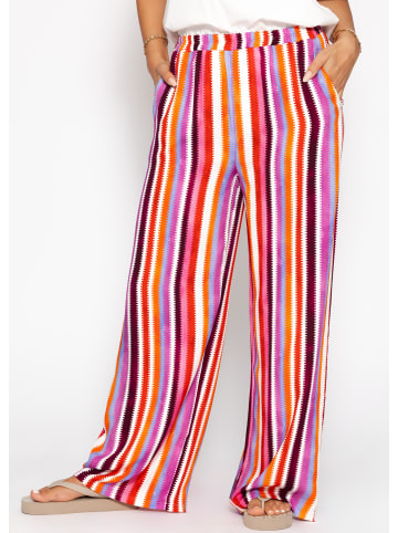 SASSYCLASSY Gemusterte Hose mit weitem Bein in Pink