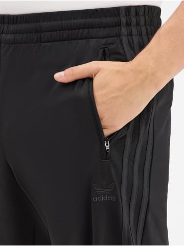 Adidas originals Hose Firebird in schwarz