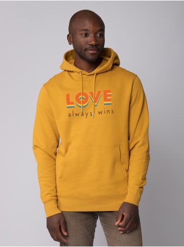 wat? Apparel Sweatshirt Love always wins in Ochre