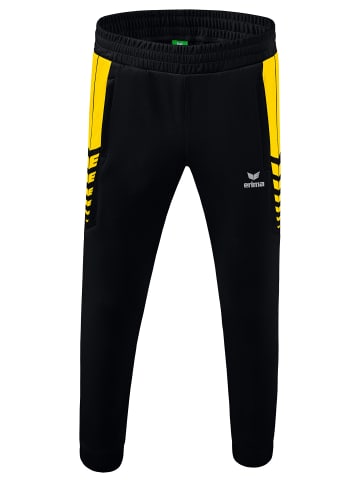 erima Kinder Six Wings Trainingshose in schwarz/gelb