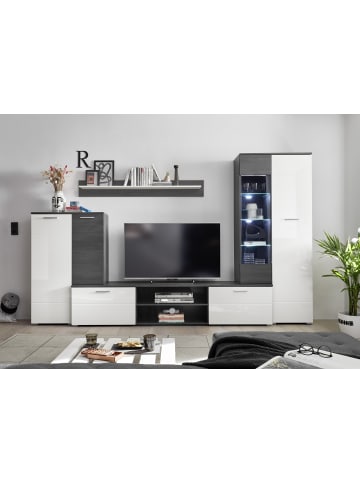 Vaja Wohnwand in Hochglanz weiß lackiert, Absetzungen schwarz.