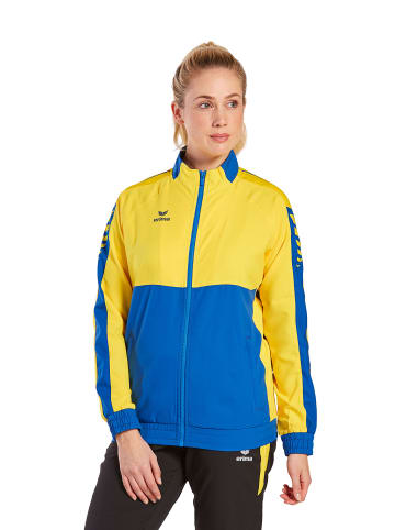 erima Damen Six Wings Präsentationsjacke in new royal/gelb