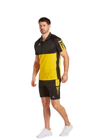 erima Herren Six Wings Poloshirt in gelb/schwarz