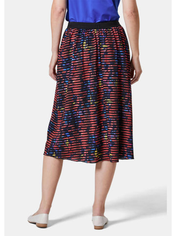 GOLDNER Kurzgröße:  Druckrock Ausbrenner-Rock in schwarz / koralle / gemustert