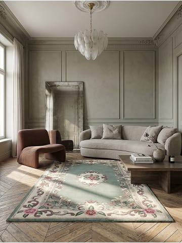 KADIMA DESIGN Traditioneller Wollteppich mit handgeschnitzten Details in Grün-Beige