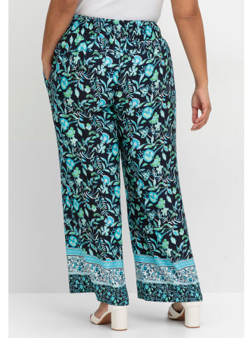 sheego Schlupfhose in tiefblau-gemustert