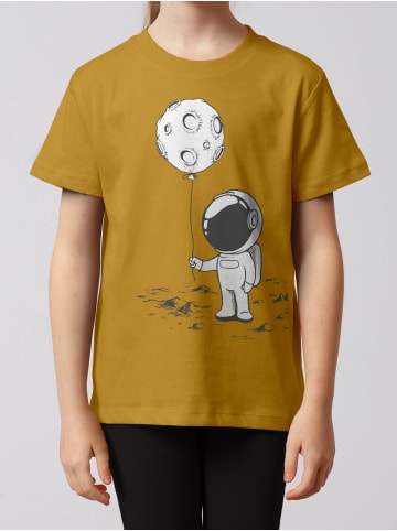 wat? Apparel T-Shirt Kleiner Astronaut mit Luftballon in Ocker