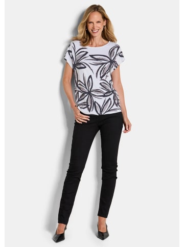 GOLDNER Kurzgröße: Paillettenshirt mit Blumenmuster in weiß / gemustert