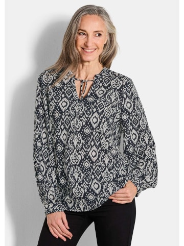 GOLDNER Kurzgröße:  Moderne Rüschenbluse mit Stehkragen in schwarz / gemustert