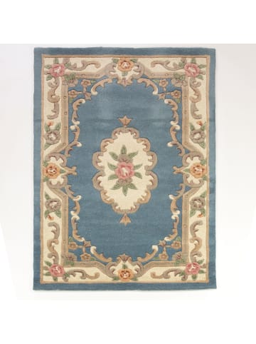 KADIMA DESIGN Traditioneller Wollteppich mit handgeschnitzten Details in Blau-Beige