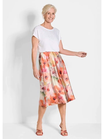GOLDNER Kurzgröße: Glänzender Midirock in floralem Druck in pfirsich / gemustert