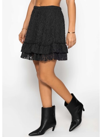 SASSYCLASSY Kurzer Volant-Rock aus Spitze in Schwarz