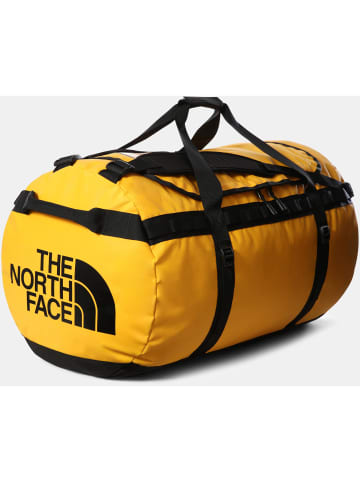 The North Face Reisetasche BASE CAMP DUFFEL - XL in summit gold-tnf black