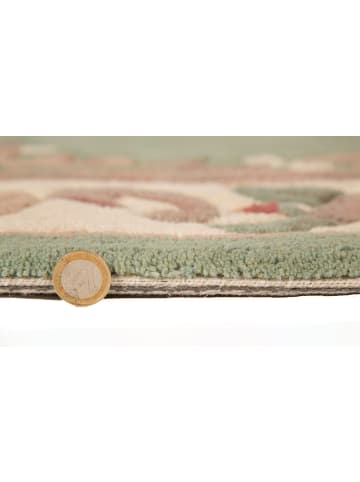 KADIMA DESIGN Traditioneller Wollteppich mit handgeschnitzten Details in Grün-Beige