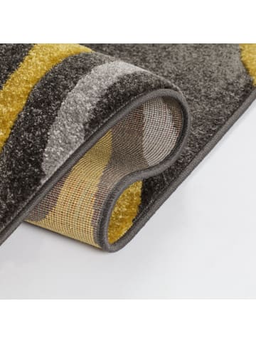 KADIMA DESIGN Abstrakter floraler Teppich in Gelb-Grau