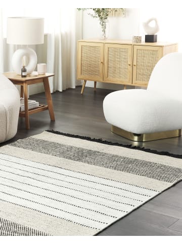 Beliani Geflochtener Teppich YAZLIK in Beige/Schwarz - (W) 140 x (H) 1.5 x (L) 200 cm