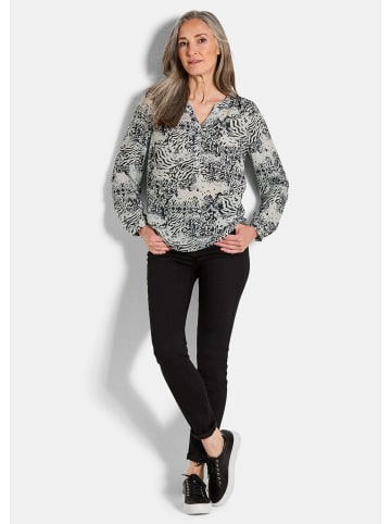 GOLDNER Kurzgröße:  Florale Druckbluse mit V-Ausschnitt in schwarz / gemustert