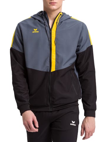 erima Squad Tracktop Trainingsjacke mit Kapuze in slate grey/schwarz/gelb