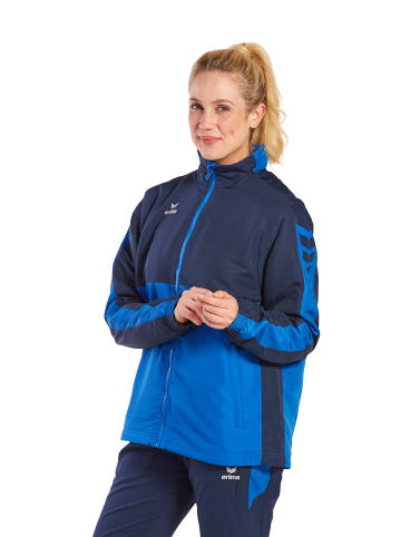 erima Six Wings Jacke mit abnehmbaren Ärmeln in new royal/new navy