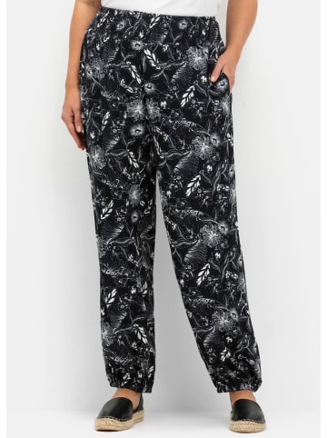 sheego Schlupfhose in schwarz-weiß