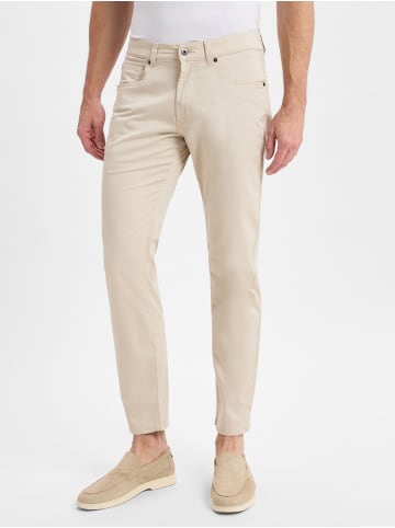 Andrew James Hose in sand