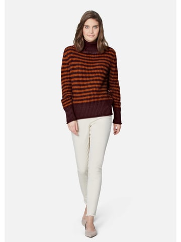 MADELEINE Softer Schurwoll-Pullover mit stylischen Streifen in mattorange / dunkelrot