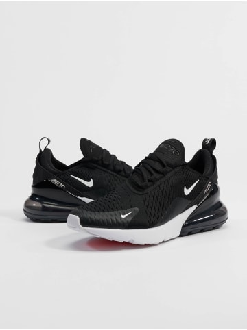 Nike Turnschuhe in black/red