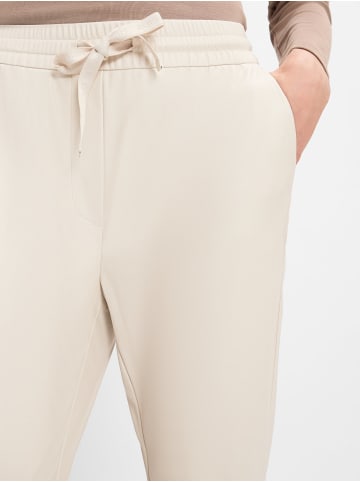 comma Lederhose in sand