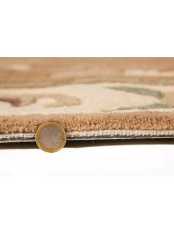 KADIMA DESIGN Traditioneller Wollteppich mit handgeschnitzten Details in Braun-Beige