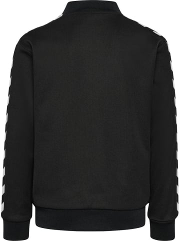 Hummel Kinder Trainingsjacke "Hmljr Archive Reg Poly Zip Jacket" in Schwarz