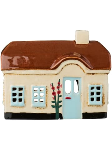 IB Laursen Lichthaus Ebeltoft – Keramikhaus mit hellblauer Tür und Stockrosen