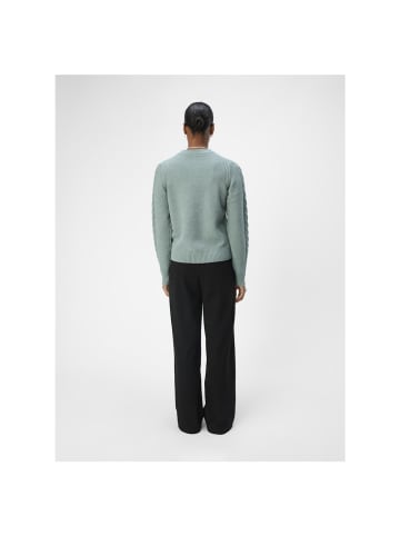 Object Pullover in dark forest