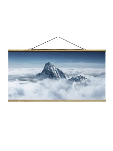 WALLART Stoffbild mit Posterleisten - Die Alpen über den Wolken in Blau