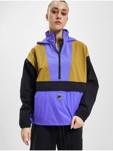 Nike Windbreaker in medium blue/black/golden moss