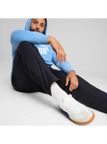 Puma ESS Woven Pants mit Mesh-Innenfutter in Blau