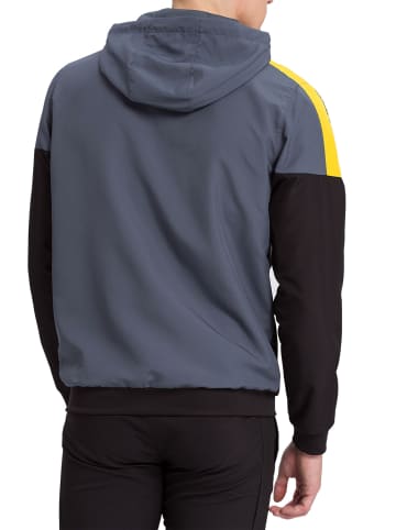 erima Squad Tracktop Trainingsjacke mit Kapuze in slate grey/schwarz/gelb