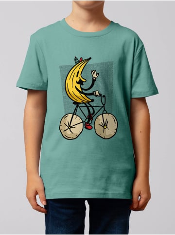 wat? Apparel T-Shirt Banana Rider in Teal Monstera