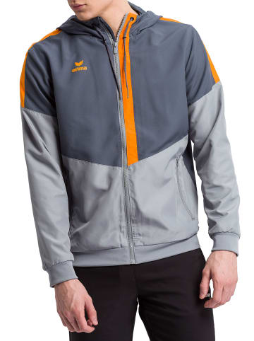 erima Squad Tracktop Trainingsjacke mit Kapuze in slate grey/monument grey/new orange