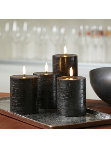 Uyuni 4er Set LED Kerzen PIA Rustik-Optik H: 10cm mit Batterien und Fernb in schwarz