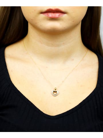 Diamant L'éternel Halskette mit Anhänger aus 375 Gelbgold mit Diamant Herz-Design