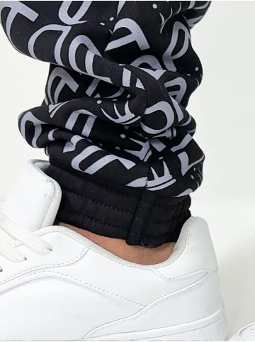 DADA Baggy Design Jogginghose All Over Print mit Kordelzug in Schwarz