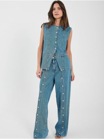 Norr Weste Kenzie in Medium blue denim