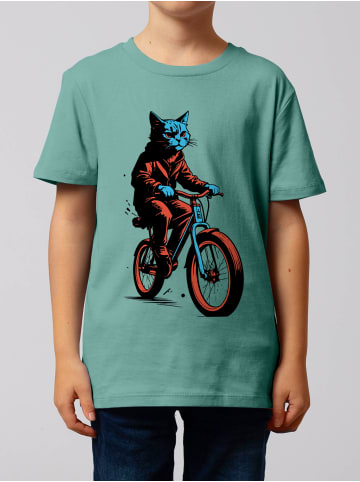 wat? Apparel T-Shirt Katze auf Fahrrad in Teal Monstera