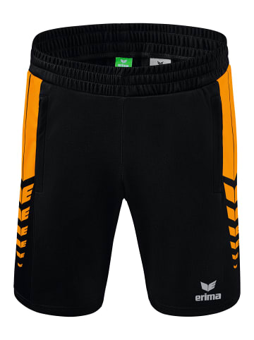 erima Six Wings Shorts in schwarz/new orange